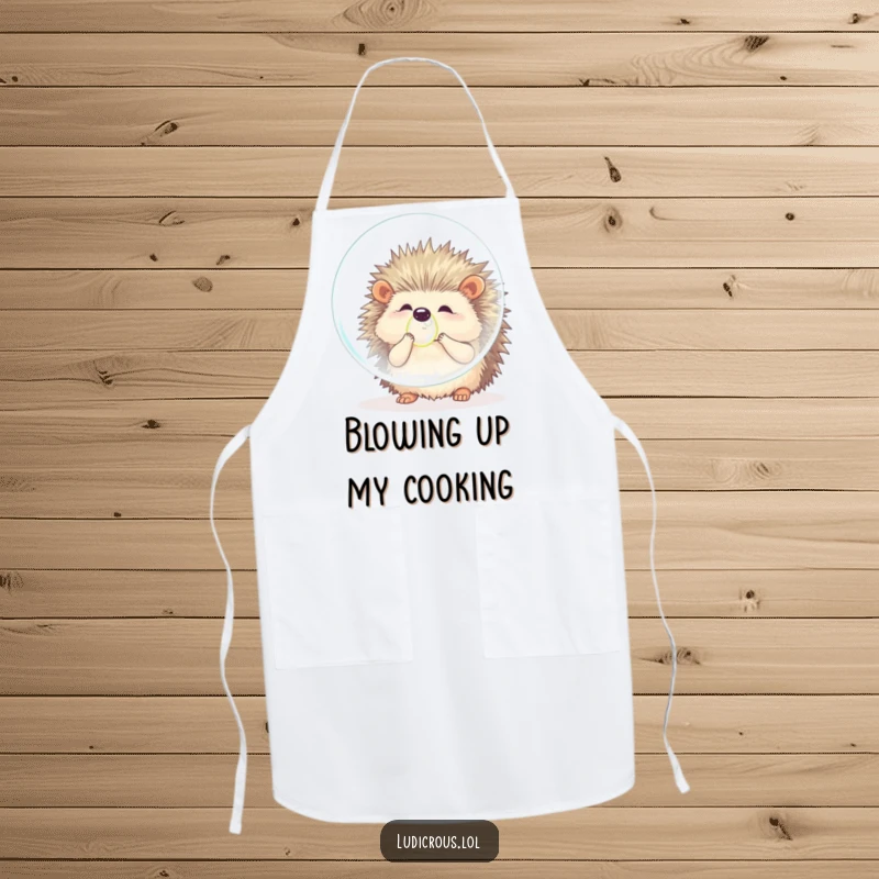 Funny hedgehog apron showing a fluffy animal comically attempting to blow a huge bubble while cooking, adding playful effort and humor to the kitchen.
