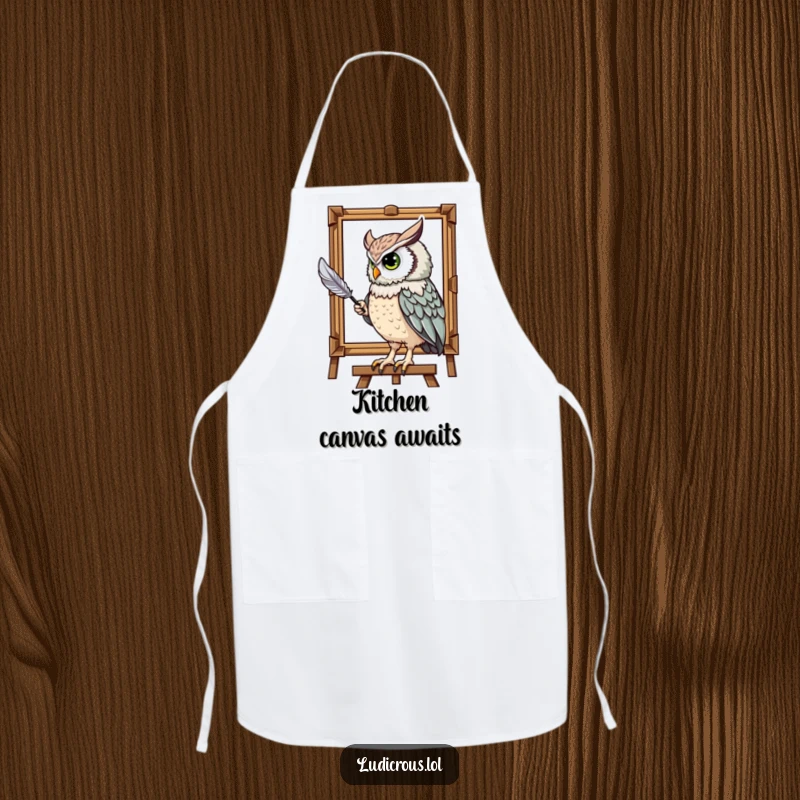 Funny apron with a majestic owl humorously painting a portrait using its tail feather, perfect for a humorous kitchen gift.