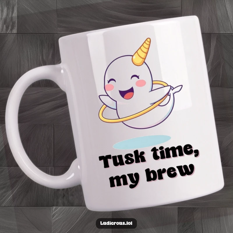 Funny narwhal mug with a happy narwhal character attempting to spin a hula hoop using its impressive tusk, showcasing hilarious effort.