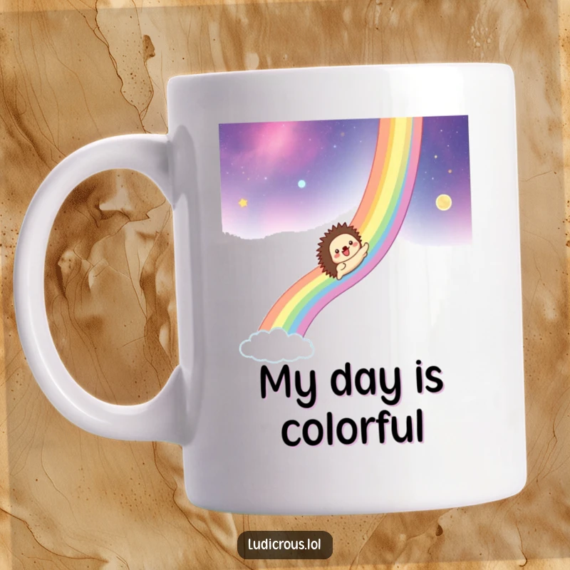 Funny mug graphic of a hedgehog gleefully sliding down a vibrant rainbow that arcs across a starry, cosmic background.