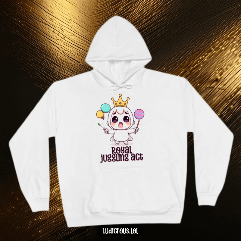 Funny hoodie showing a surprised character wearing a tiny crown, struggling comically to juggle oversized, unstable objects.
