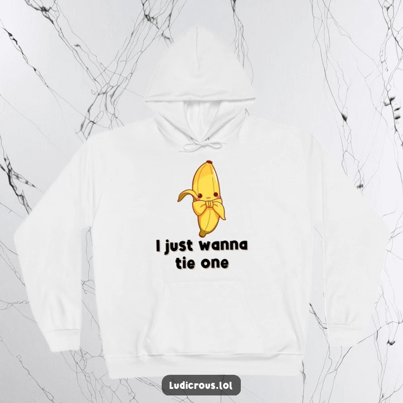 Funny hoodie showcasing a curious banana peel hilariously attempting to tie a bow, perfect for warm and humorous lounging.