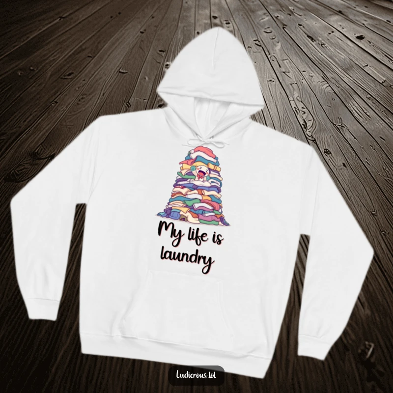 Funny hoodie featuring a determined sock puppet attempting to climb a monumental pile of laundry, ideal for cozy motivation.