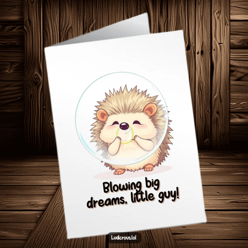 Funny free printable birthday card featuring a fluffy hedgehog struggling to blow a gigantic bubble, looking surprised.
