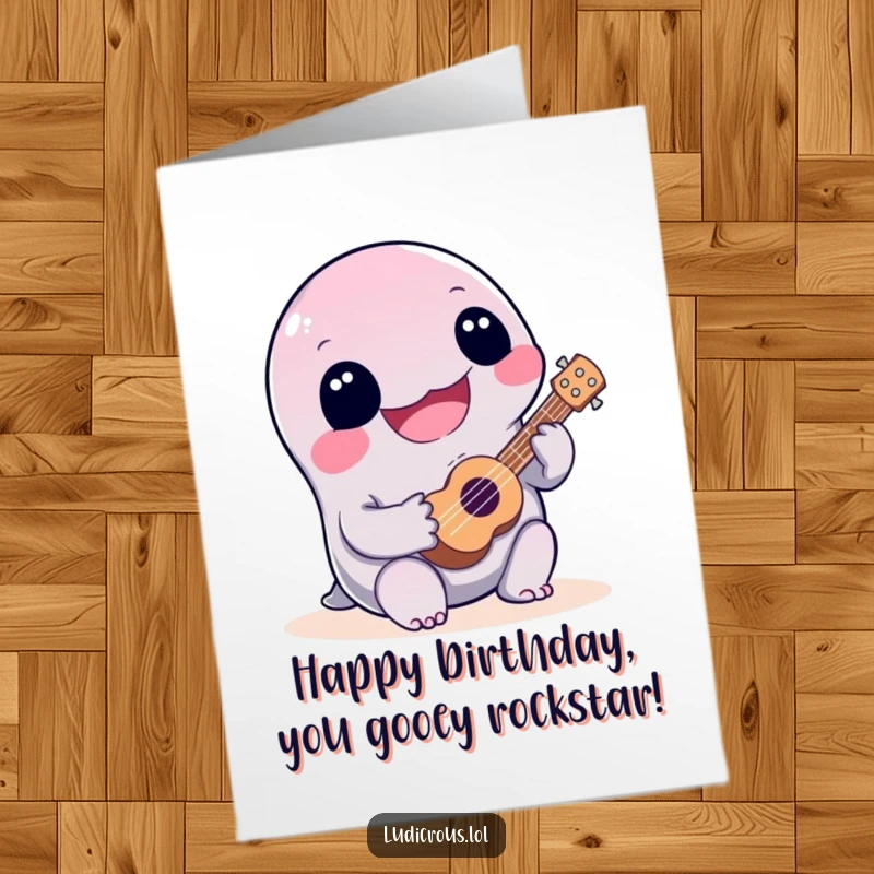 Funny Free Printable Birthday Card: Joyful slime creature plays a tiny ukulele very badly. Downloadable DIY gift.