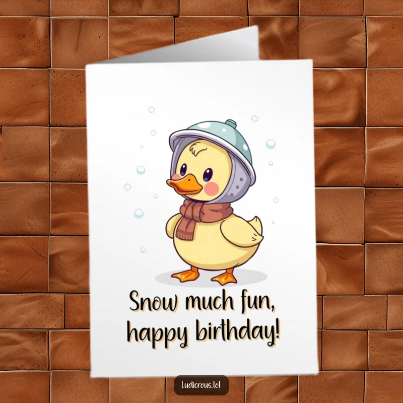 Funny Free Printable Birthday Card: A duck in a colander hat humorously fails to catch snowflakes, bringing winter laughs.