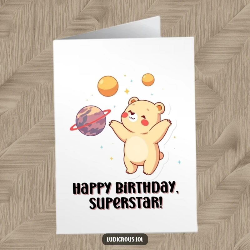 Funny Free Printable Birthday Card: Bear gleefully juggling planets, radiating wonder and birthday cheer.