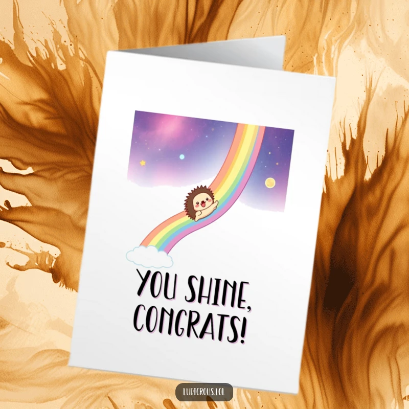 Funny Free Printable Congratulations Card: A hedgehog joyfully slides down a vibrant rainbow across the cosmos, marking a fantastic win.