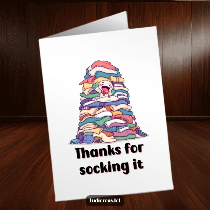 Funny Free Printable Thank You Card: A determined sock puppet climbs a monumental pile of laundry, expressing thanks for big efforts.