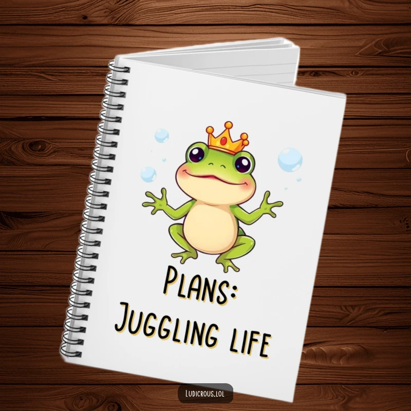 Funny Notebook with a silly frog character in a crown, juggling slippery soap bubbles, great for notes and ideas.