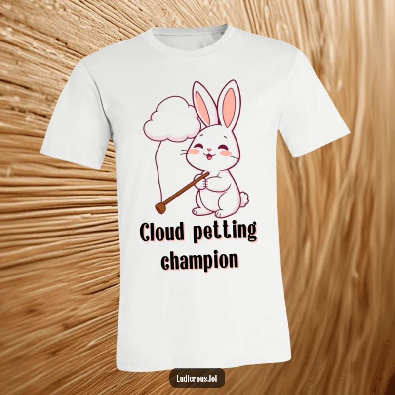 Funny rabbit t-shirt depicts a cheerful bunny using a comically long pole to try and pet a soft, white cloud.