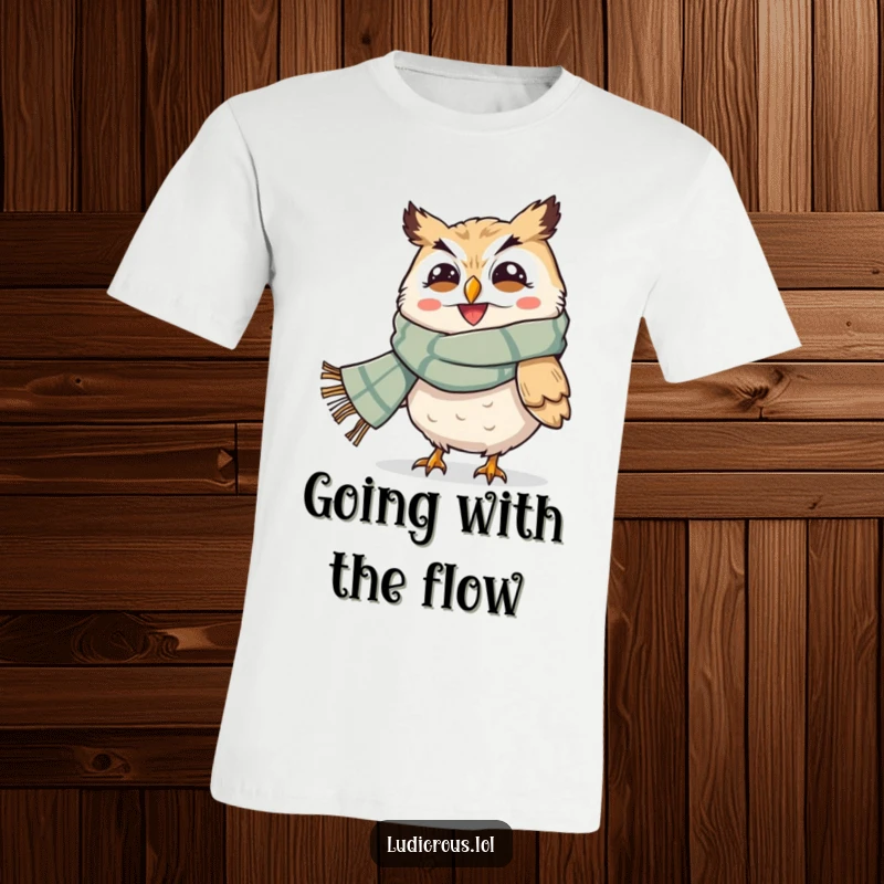 Funny t-shirt depicting a grinning owl with an oversized scarf being powerfully blown by the wind, showcasing humorous weather effects.