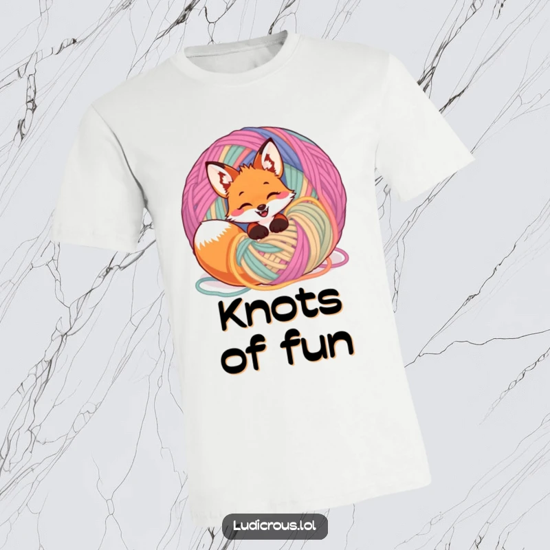 Funny giggling fox entangled in a massive ball of bright yarn on a t-shirt, showcasing playful mischief and cozy fun.