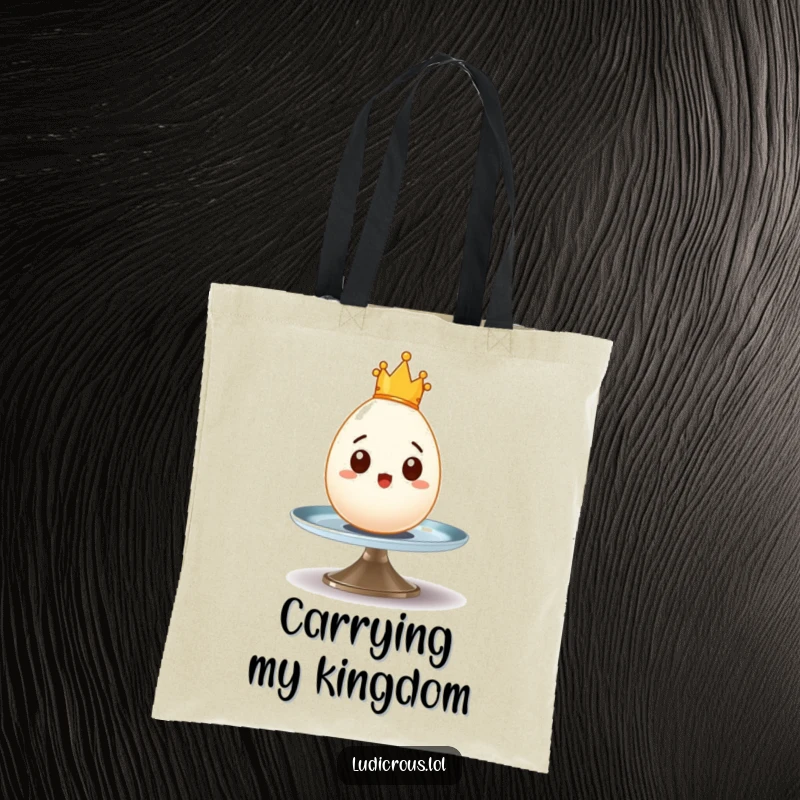 Funny tote bag with a surprised egg wearing a tiny crown wobbling precariously on a spinning plate, perfect for groceries.
