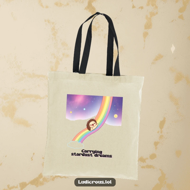 Funny tote bag with a hedgehog gleefully sliding down a rainbow across a cosmic background, perfect for carrying dreams.